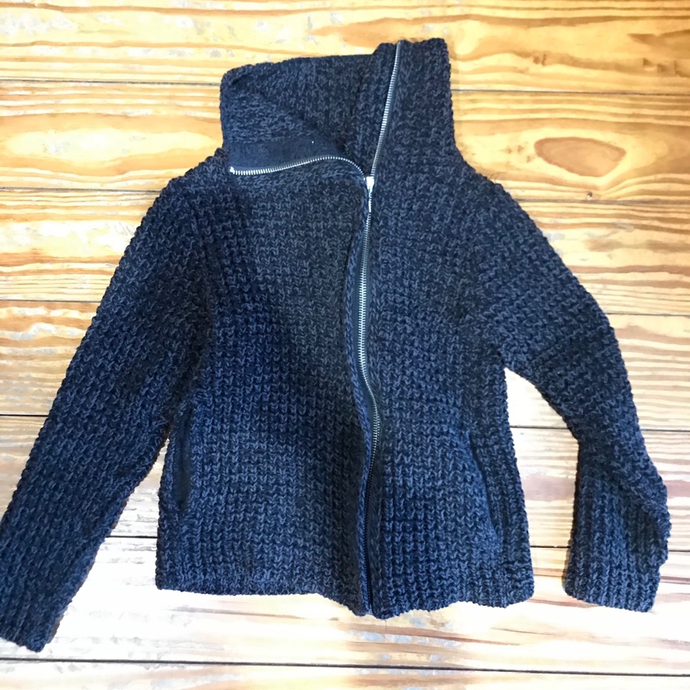 Woman’s sweater jacket.